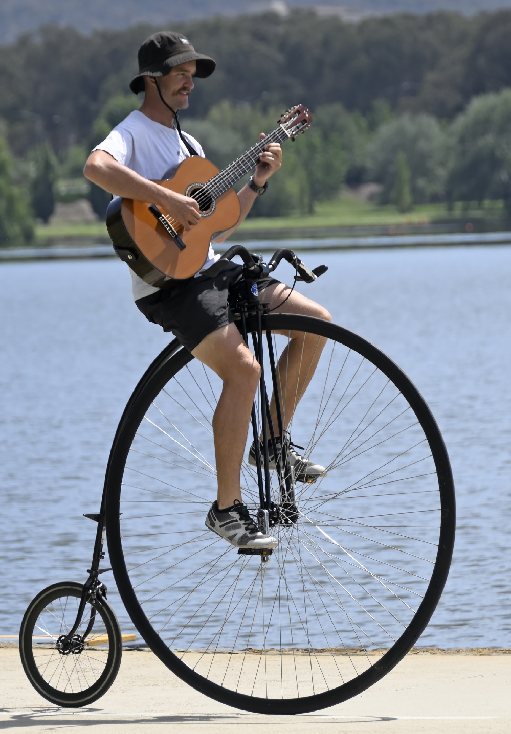 Simon the Bike Guy riding his penny-farthing